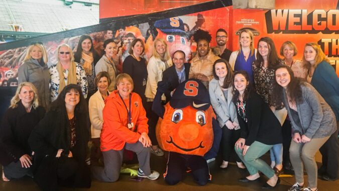 Lerner Center Staff Poses with Syracuse Students for Monday Mile